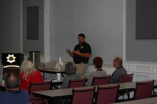 Deputy teaching citizens in a classroom setting