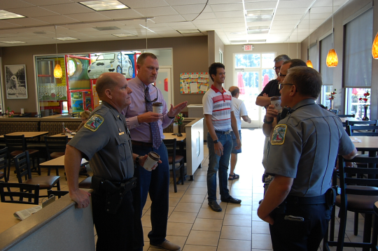 Deputies and Citizens in a coffee shop talking