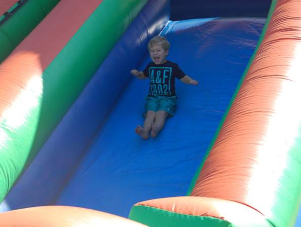 Child going down a water slide