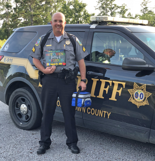 School resource deputy Standing in front of Vehicle