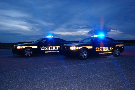 Two Sheriffs Office patrol Vehicle at night